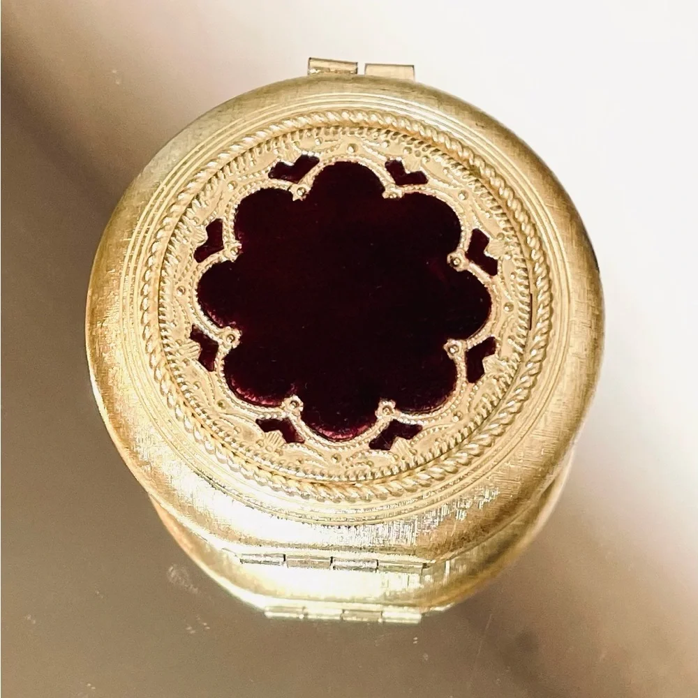 Vintage Revlon “Love Pat” Gold-tone Powder Compact with Burgundy Velvet Accent.